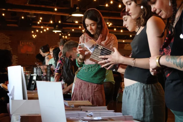 Kelowna's second annual Queer Zine Fair saw over a dozen tables filled with zines, artwork, and crafts, as well as an open mic at the historic @LaurelPackinghouse. Around thirty creatives came together from the 2DLGBTQIA+ community to exhibit for free, and over a hundred visitors came through the door for the niche artform.

The name “zine” comes from magazine; they can be any kind of self-published written, illustrated, collaged, and creative publications. Zines have been a powerful underground and DIY force of expression and cultural movement in the 2SLGBTQIA+ community since the photocopier revolution of the ‘70s. The rise of the internet and social media has put the artform on the digital fringes, but it's been recently making a comeback as people look to connect and express in physical space. 
.
.
.
#2SLGBTQIA+ #LGBTQ #KelownaPride #PrideMonth #KelownaEvents #LaurelPackinghouse #DowntownKelowna #KelownaMuseums