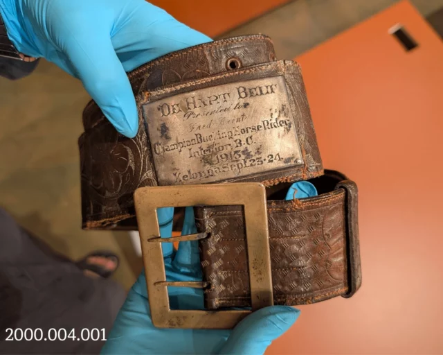 During the 1913 Kelowna Fall Fair, "cowboy sports" were a popular attraction held over two days. This belt, along with a $75 prize, was presented by F.R.E. DeHart to Ferdie Brent, who secured first place as a bronco rider. Interestingly, the belt is engraved "Fred" due to a mistake.

According to the Orchard City Record's account of the event, "some of the horses fought most violently, and those who kept their seats triumphantly through the ordeal deserved all the applause they got."

Come visit the Okanagan Heritage Museum to check out our newest exhibit! 'Ranching & Rodeos in the Okanagan' is on now. 
.
.
.
#Ranchers #Ranching #Rodeos #Cowboys #NewExhibit #NewExhibition #DowntownKelowna #SaddleUp #KelownaMuseums #Kelowna #ExploreKelowna #YLW